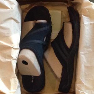Sandal, worn outside once, inside once